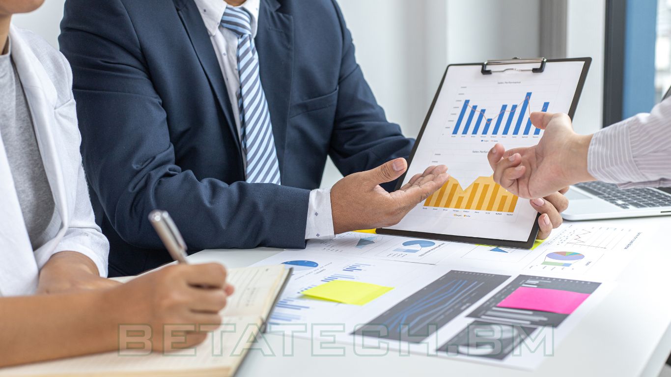 Business continuity planning meeting with professionals reviewing disaster recovery strategies in Bermuda